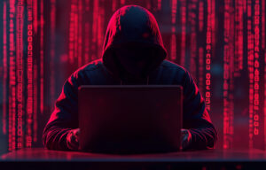 Cyber hacker attack concept. Abstract digital hacker man with a laptop. Male criminal, hoodie and ready for coding, cyber-attack and programming for malware with tech, scam and data
